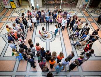 An overhead shot of participants in a circle taking part with Doing Things Differently at Bristol Museum