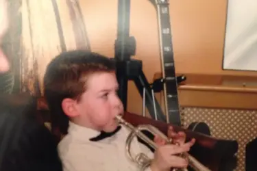 Harry Bassett in his youth, playing trumpet.