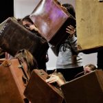 'A case for inclusivity' - performers hold up vintage suitcases to the audience