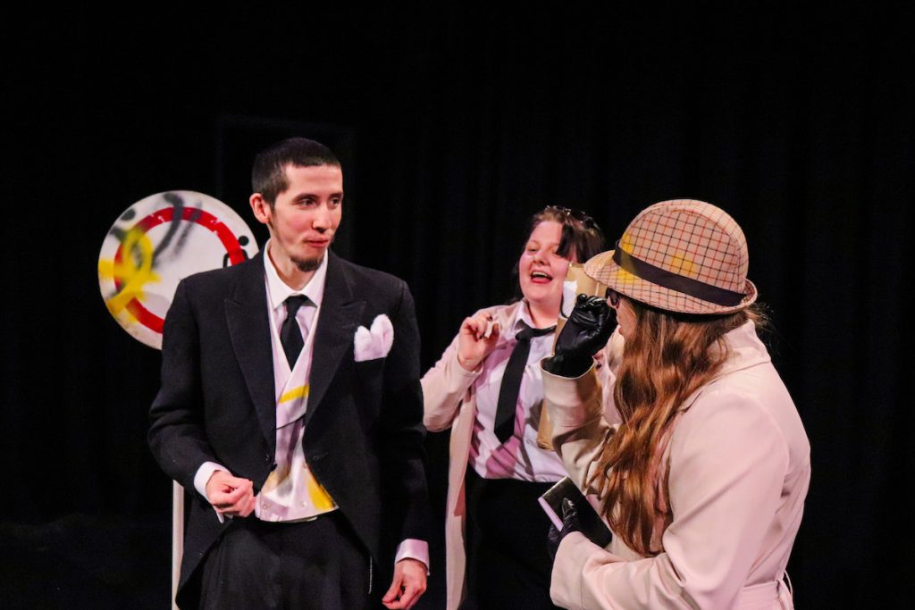 Extraordinary Bodies Young Artists perform Till We Win at Lighthouse Poole - close up of Josh Ward, Natalya Howard and Rachel Orum performing centre stage.