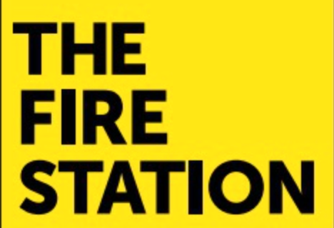 A yellow background with The Fire Station written in black